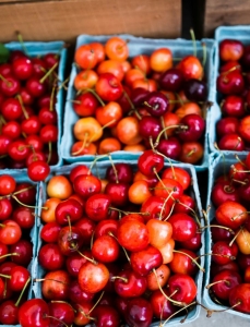 Seasonal produce - fresh cherries in packages for the farmers market in May