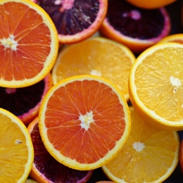 several slices of different colored oranges