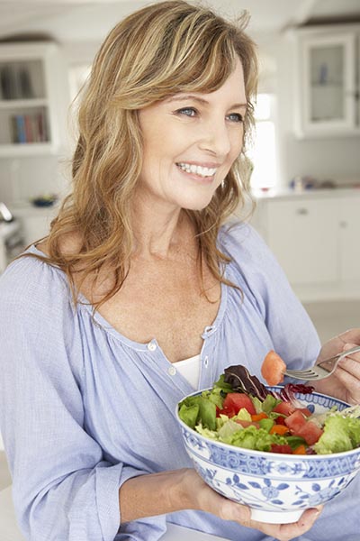 a woman eating salad