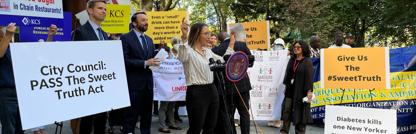 CSPI's DeAnna Nara speaks to the crowd at a rally in support of the NYC Sweet Truth Act on September 14.