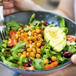 chickpea, avocado, salad in bowl with fork