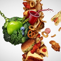 a wrecking ball of produce smashing into unhealthy foods