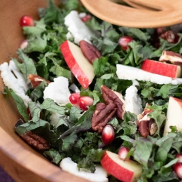 salad with kale, apples, pecans, and pomegranate