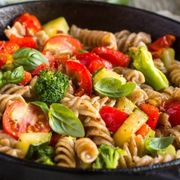 a skillet of pasta and vegetables