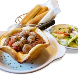 olive garden's meatball pizza bowl with breadsticks and side salad