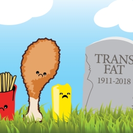 cartoon of french fries, fried chicken, and margarine next to gravestone that reads "trans fat 1911-2018."