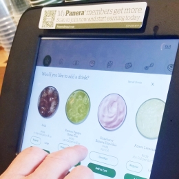 person using a digital restaurant ordering machine