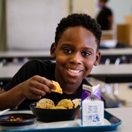 A boy eating school lunch