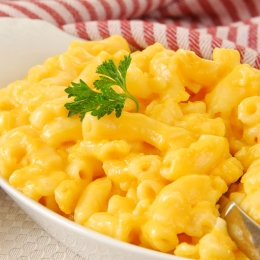 large bowl of mac & cheese in white bowl