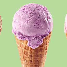 3 ice cream cones with one chocolate scoop, one purple scoop, one pink scoop on a green background.
