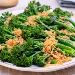 plate with broccolini sprinkled with parmesan crumbs