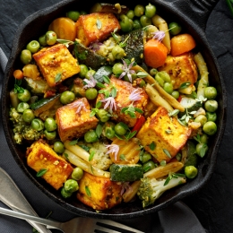 skillet filled with vegetables and tofu