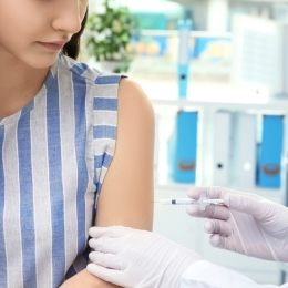 young woman receiving vaccine