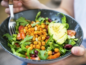 chickpea, avocado, salad in bowl with fork