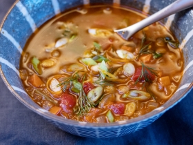 a bowl of greek lentil soup