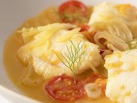 poached white fish in tomato broth