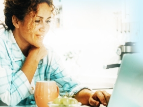 woman looking at laptop screen
