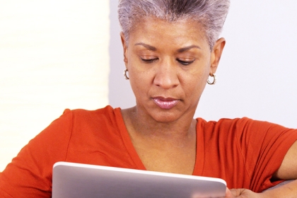 a woman reading news on her tablet