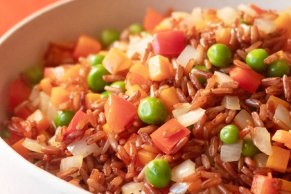 fried brown rice with carrots and peas