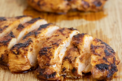 grilled chicken on cutting board