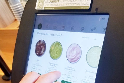 person using a digital restaurant ordering machine