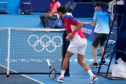 Tennis player Novak Djokovic from behind on the court