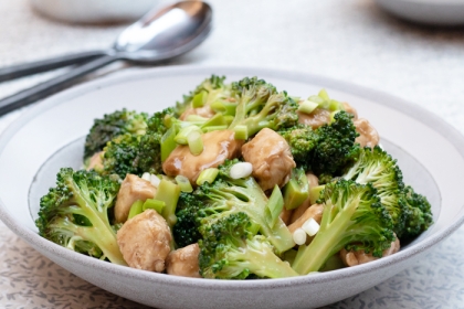 shallow white bowl of chicken and broccoli 