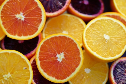 several slices of different colored oranges
