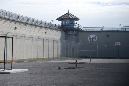 Empty prison courtyard with basketball