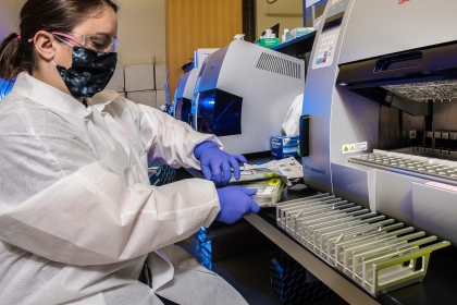 A CDC scientist unpacking testing kits