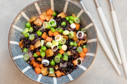 bowl filled with black rice and chopped veggies