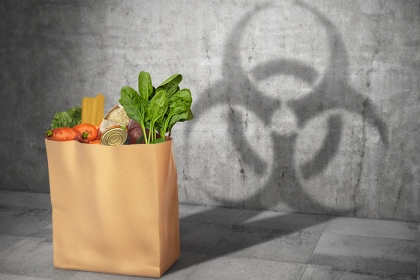 grocery bag casting a shadow of a hazardous chemical symbol