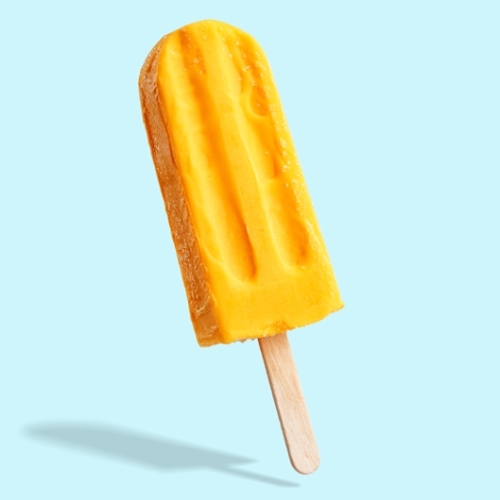 yellow popsicle on light blue background 