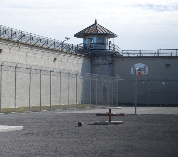 Empty prison courtyard with basketball