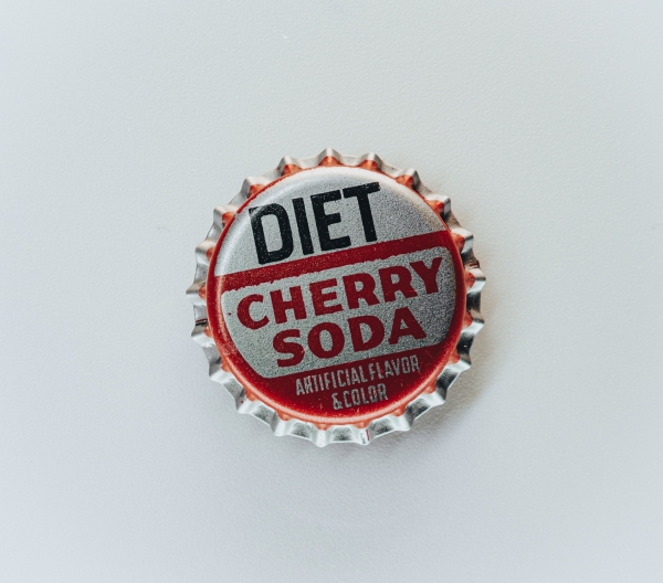 Bottle cap that say "Diet Cherry Soda - Artificial Flavor & Color"