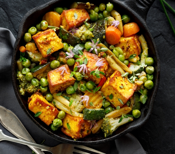 skillet filled with vegetables and tofu
