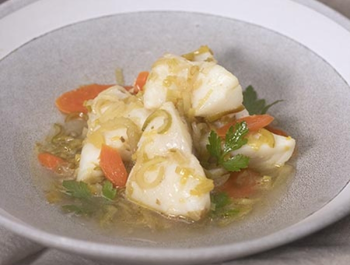 white fish poached with leeks, carrots, and celery