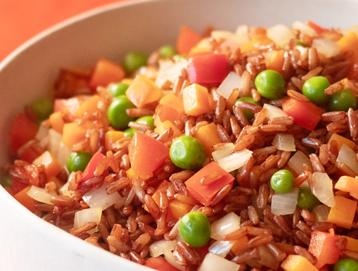 fried brown rice with carrots and peas