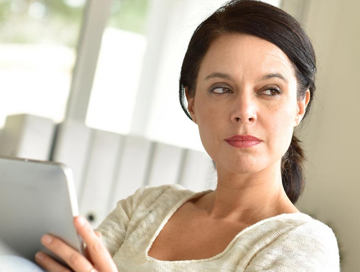 woman holding a tablet screen