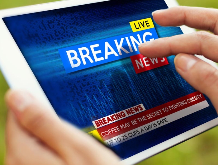 tablet with "breaking news" on it