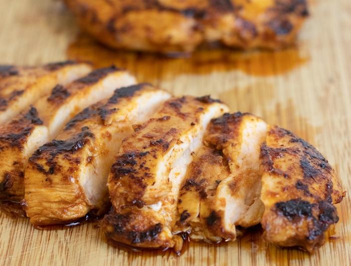 grilled chicken on cutting board