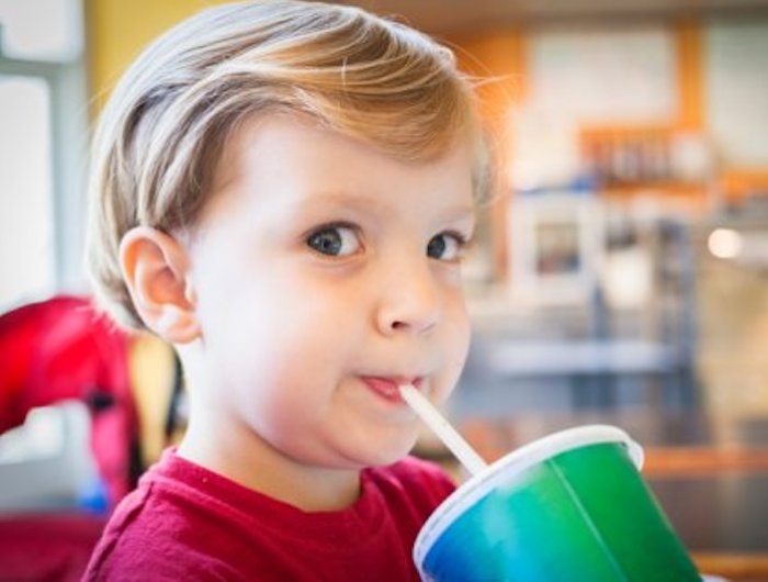 Child drinking through straw