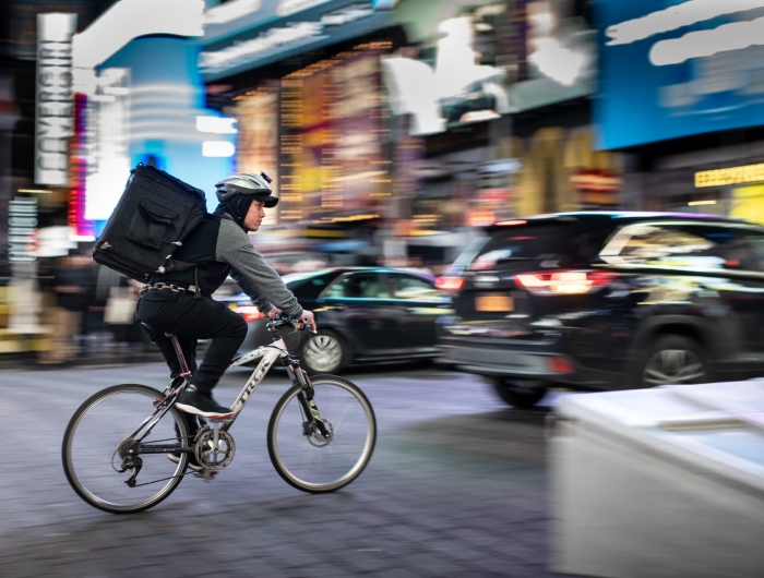 A food delivery bicyclist in Times Square, New York