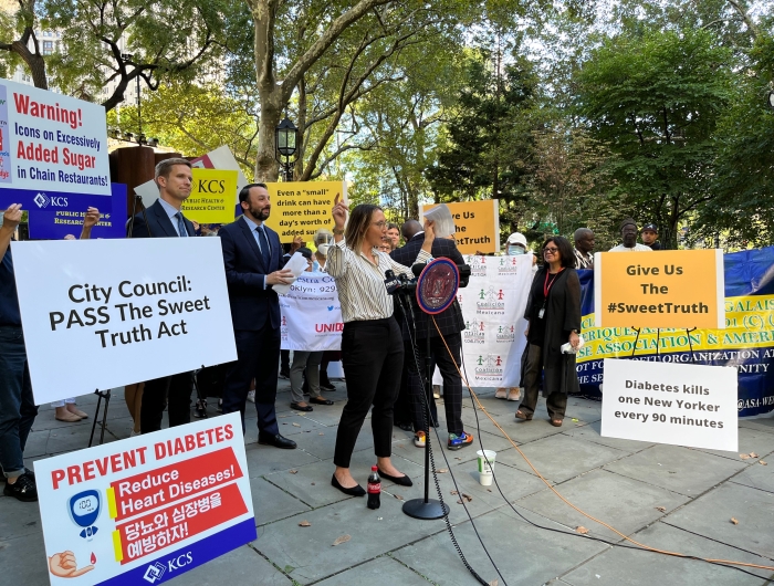 CSPI's DeAnna Nara speaks to the crowd at a rally in support of the NYC Sweet Truth Act on September 14.