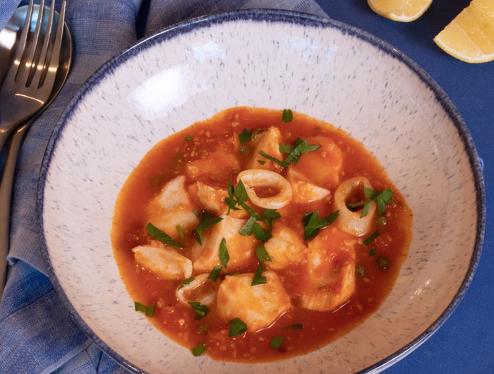 white bowl with seafood stew