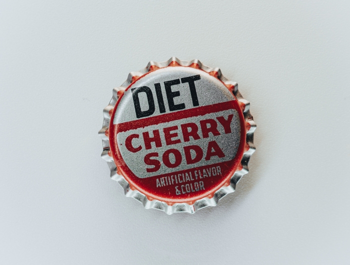Bottle cap that say "Diet Cherry Soda - Artificial Flavor & Color"