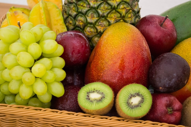 Fruit: grapes, kiwis, apples, starfruit, a pineapple and a mango