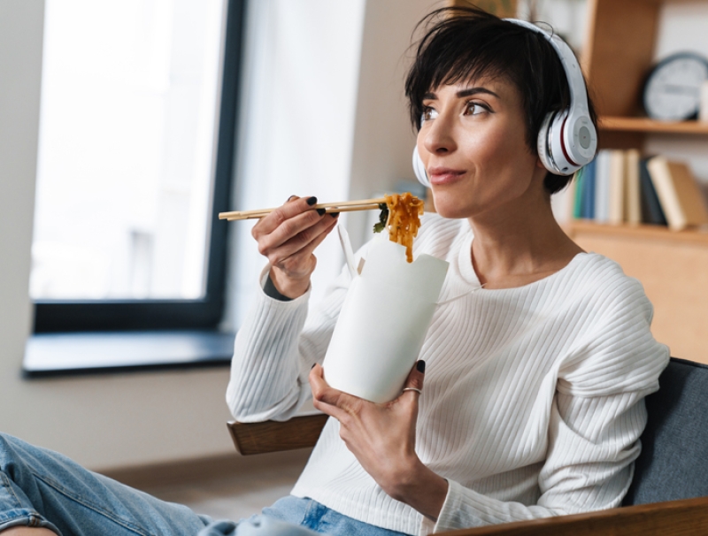woman eating listening to music