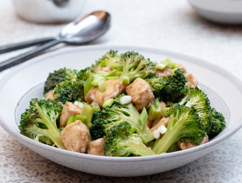shallow white bowl of chicken and broccoli 