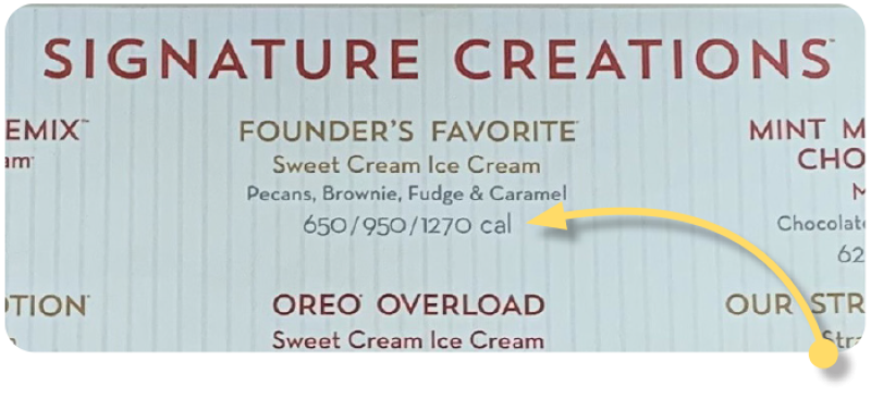 Cold Stone menu board showing calorie amounts for signature creations